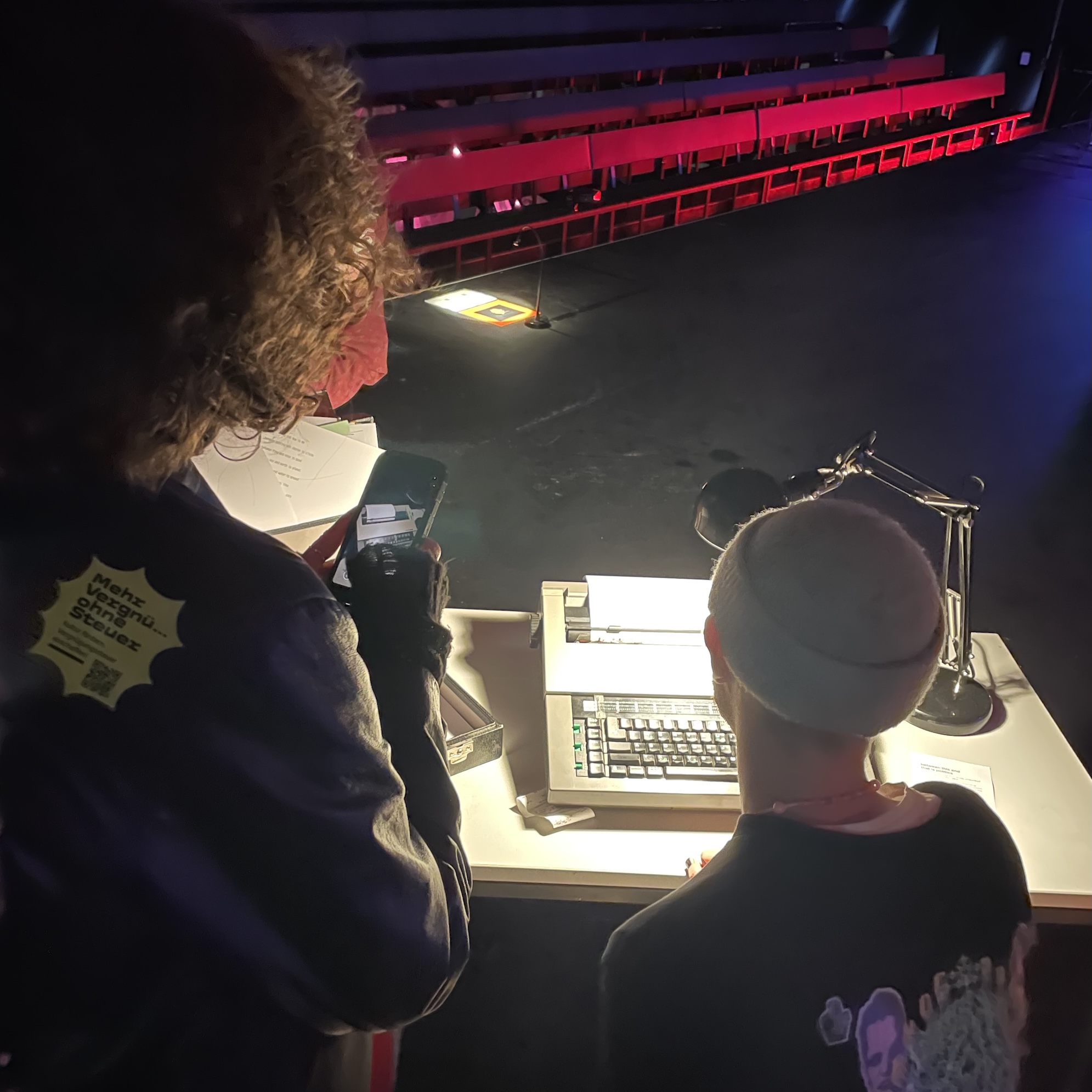 Visitors typing on the typewriter at Schmiede, Hallein
